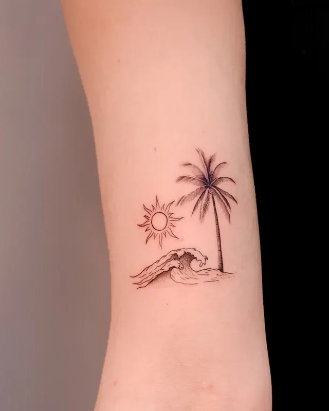 Madeira memory palm tree, sun and wave tattoo on the arm