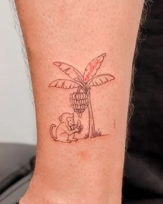 Madeira memory banana tree and monkey tattoo on the arm