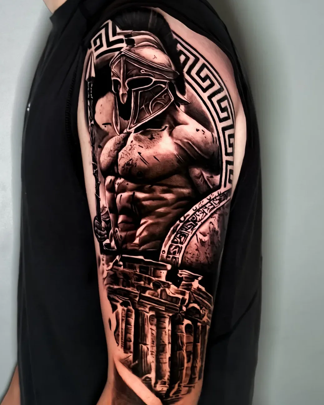 Realism Spartan warrior and Greek columns tattoo on the arm
