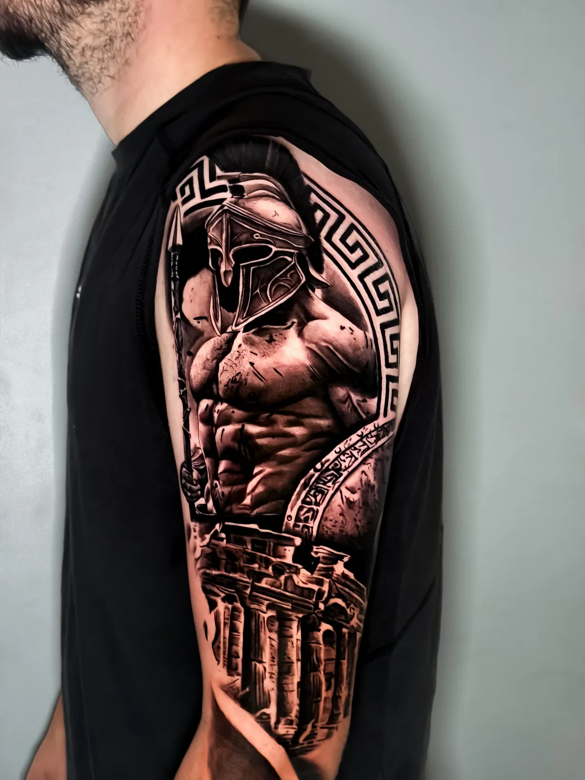 Spartan warrior with Greek columns in black and grey by Hugo Gonzalez